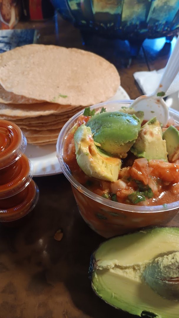 Fresh ceviche with avocado and cilantro.