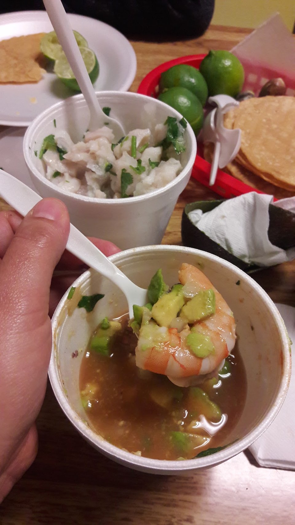 Fish tacos and tostadas pictured together.