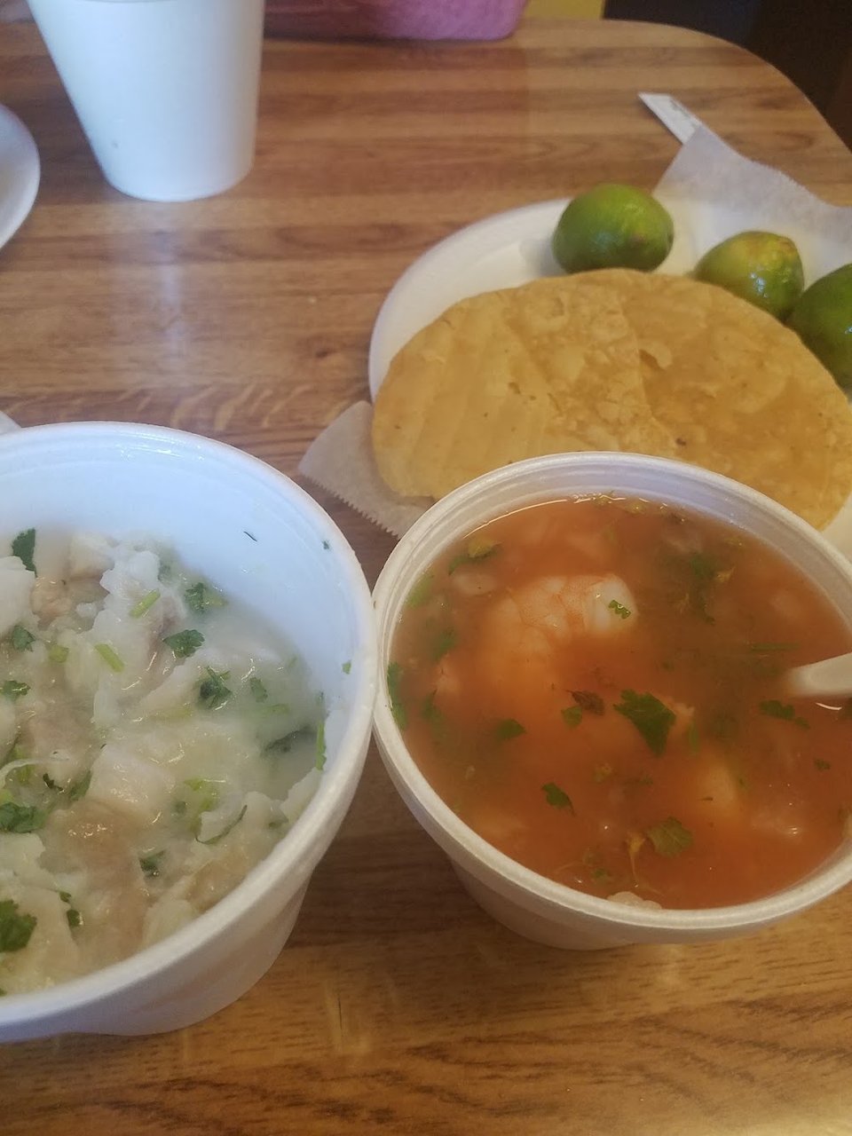 Fish tacos and tostadas pictured together.